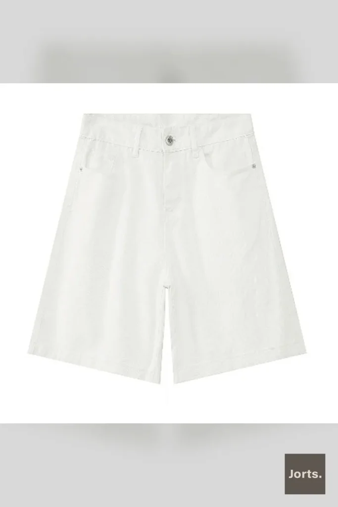 Side profile of light blue baggy cotton blend pants, highlighting the relaxed fit and Y2K style.