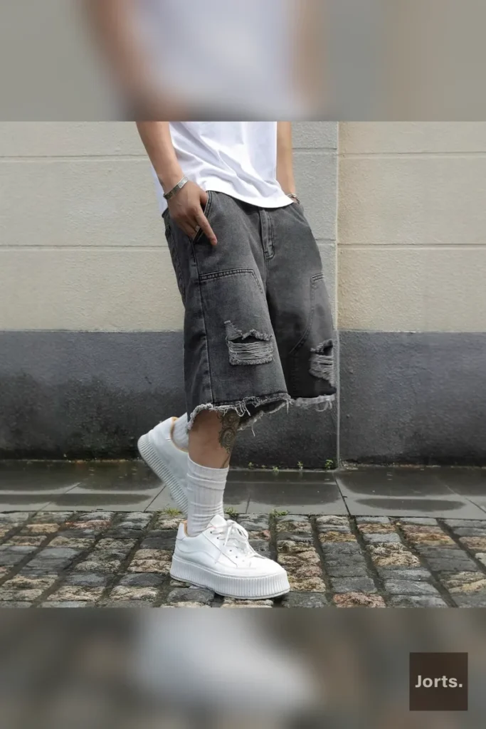 Mens gray denim jorts styled for a vintage-inspired streetwear outfit, ideal for summer.