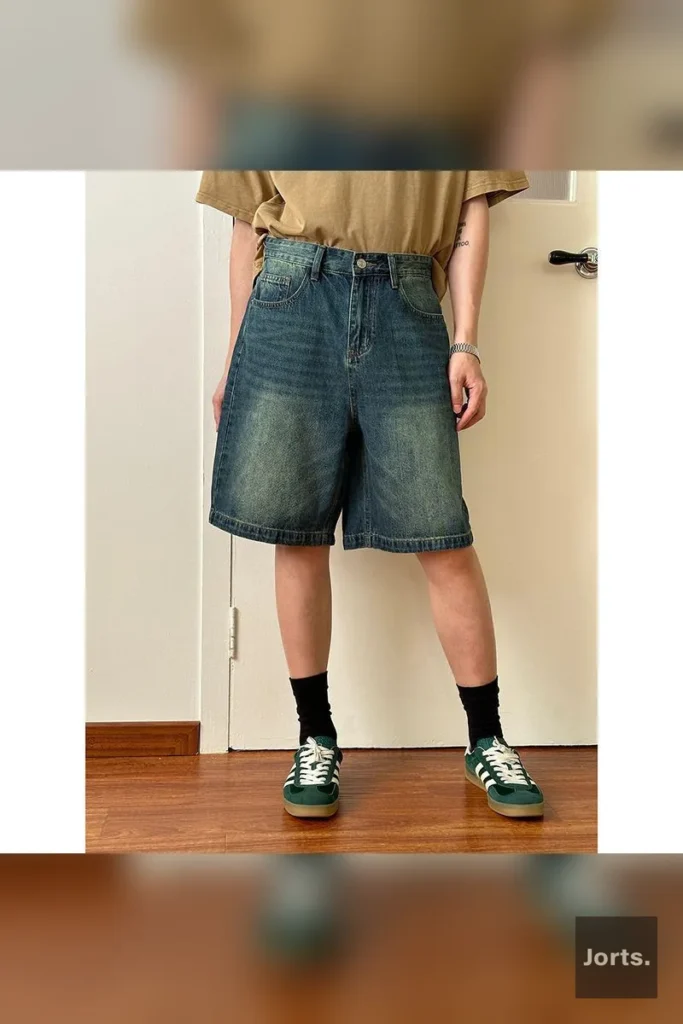 Close-up of the retro washed chemical fibre blend fabric on men's denim jorts.