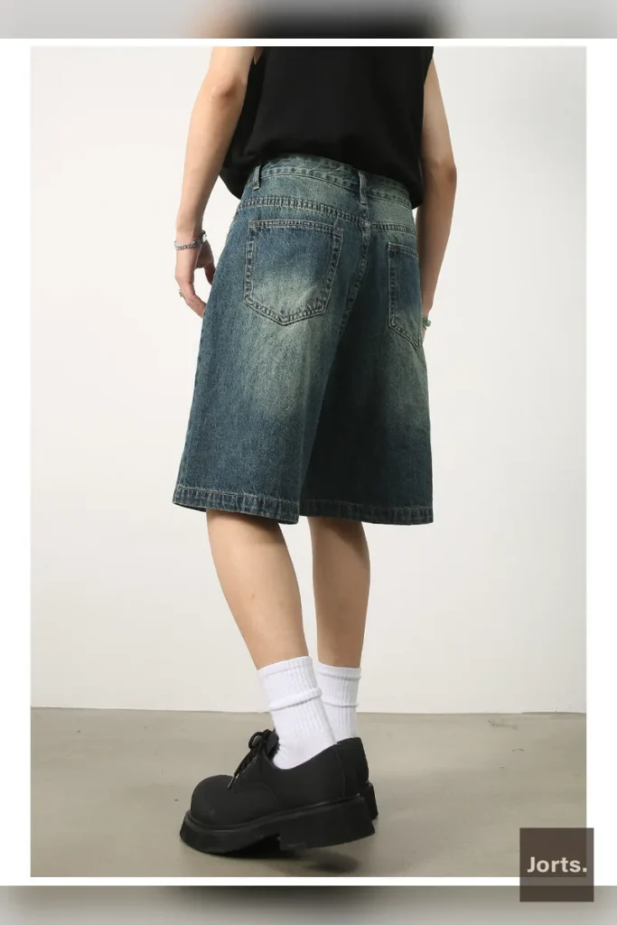 Detailed shot of vintage blue loose fit pants, emphasising the quality of the cotton blend material.