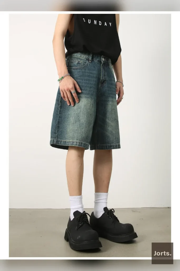 Model wearing vintage blue Y2K loose fit cotton blend pants, showcasing the baggy streetwear style.